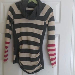The limited sweater size small. Grey,  creme and hot pink stripes, rushed sides.